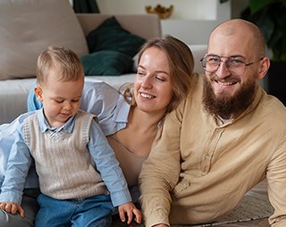 Famil with kid playing